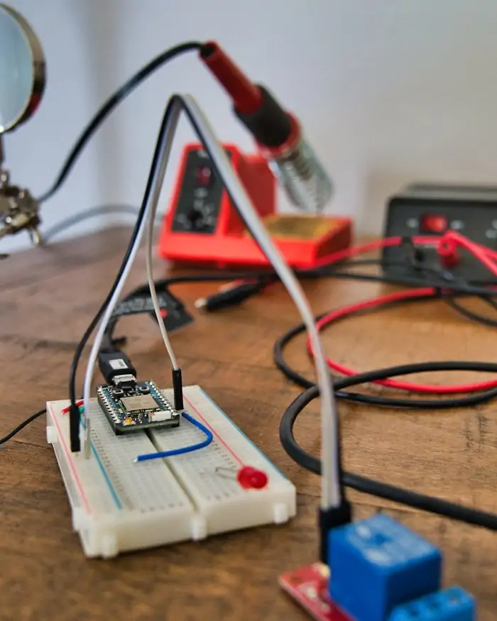 A test circuit wired on a breadboard with instrument leads attached.