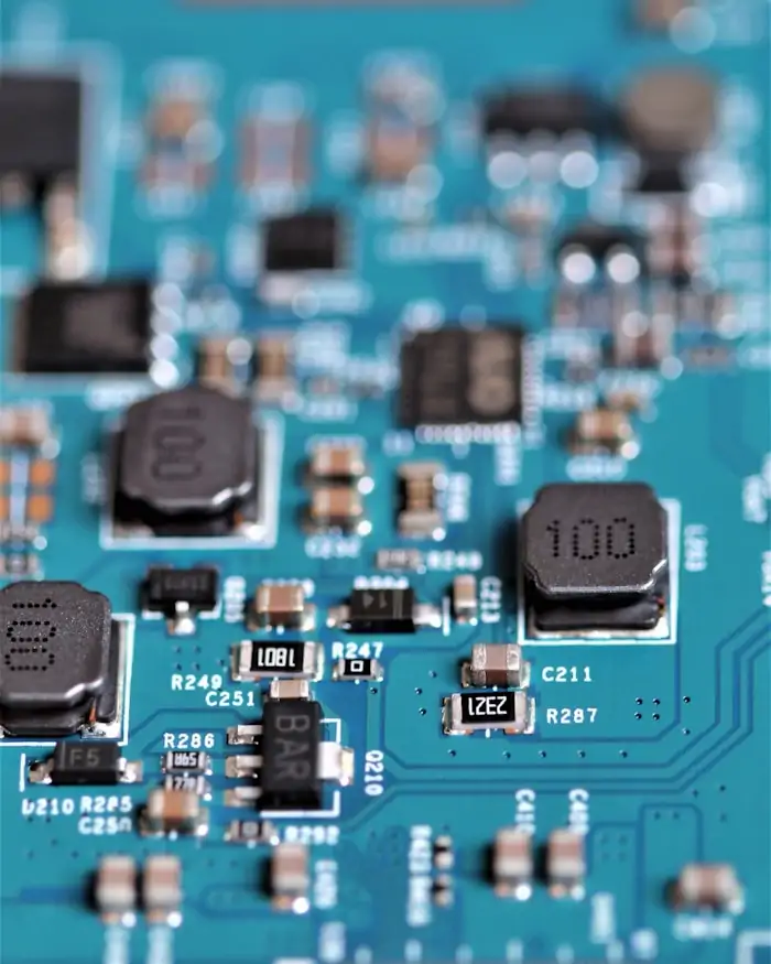 Macro photograph of a circuit board showing surface-mounted controller and memory components.